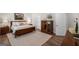 Primary bedroom showcasing a comfortable bed, tasteful decor, and ample natural light at 2124 Gaddis Rd, Canton, GA 30115
