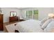 Serene bedroom with soft bedding, plenty of natural light, and classic furniture at 2124 Gaddis Rd, Canton, GA 30115