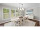 Bright dining room featuring large windows, elegant lighting, and stylish decor at 2124 Gaddis Rd, Canton, GA 30115