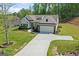 Charming single-Gathering home with manicured lawn, beautiful landscaping, and a two car garage at 2124 Gaddis Rd, Canton, GA 30115
