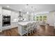 Well-appointed kitchen featuring stainless steel appliances, white cabinetry, and an island with barstool seating at 2124 Gaddis Rd, Canton, GA 30115