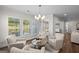 Cozy sitting area with decorative chairs and a large window overlooking the outside at 2124 Gaddis Rd, Canton, GA 30115