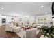 Spacious living room with open layout, seamlessly connecting to a modern kitchen and dining area at 2124 Gaddis Rd, Canton, GA 30115