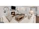 Bright and airy living room featuring a fireplace, hardwood floors, neutral decor, and ample seating at 2124 Gaddis Rd, Canton, GA 30115