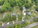 This is an aerial shot of the neighborhood in a lush, tree-filled area at 1236 Stone Mountain Lithonia Rd, Lithonia, GA 30058