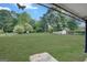 Expansive backyard featuring lush greenery, mature trees, and an outbuilding at 1236 Stone Mountain Lithonia Rd, Lithonia, GA 30058