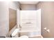 A bathroom featuring a toilet, tub-shower combination, and neutral paint at 1236 Stone Mountain Lithonia Rd, Lithonia, GA 30058