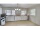 A kitchen featuring wood countertops, white cabinets, and modern appliances at 1236 Stone Mountain Lithonia Rd, Lithonia, GA 30058