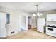 Kitchen with a classic white refrigerator and stove, light colored flooring and wood countertops at 1236 Stone Mountain Lithonia Rd, Lithonia, GA 30058