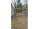 Backyard of the property, showcasing the perimeter fence and a glimpse of the shed at 4064 Sunset Sw Dr, Atlanta, GA 30331
