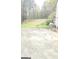 Large backyard with a patio area, a grill, storage shed, and view of the surrounding mature trees at 4064 Sunset Sw Dr, Atlanta, GA 30331