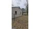 Fenced backyard featuring a chain-link fence, some trees, and a shed in the distance, needs landscape at 4064 Sunset Sw Dr, Atlanta, GA 30331
