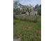 Property with a large backyard featuring trees and a shed visible beyond the perimeter at 4064 Sunset Sw Dr, Atlanta, GA 30331
