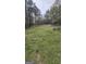 Spacious backyard with a storage shed, set amongst tall trees and natural surroundings at 4064 Sunset Sw Dr, Atlanta, GA 30331
