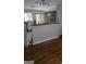 View of a kitchen with a breakfast bar, stainless steel appliances, and a connecting room, ideal for dining at 4064 Sunset Sw Dr, Atlanta, GA 30331