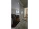 Inviting living room with hardwood floors, a comfortable gray sofa, and ample natural light from the window at 4064 Sunset Sw Dr, Atlanta, GA 30331