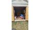Open view of a storage shed filled with household and lawn care items, offering functional and organized storage space at 4064 Sunset Sw Dr, Atlanta, GA 30331