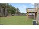 Backyard view featuring a wooden deck and ample green space in a suburban neighborhood at 588 Whitman Ln # 23, Stockbridge, GA 30281