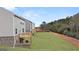 Backyard view featuring a wooden deck and ample green space in a suburban neighborhood at 588 Whitman Ln # 23, Stockbridge, GA 30281