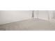 Spacious carpeted bedroom with neutral walls and multiple doorways at 588 Whitman Ln # 23, Stockbridge, GA 30281