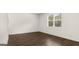 Bedroom with natural light and wood-look flooring at 588 Whitman Ln # 23, Stockbridge, GA 30281