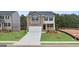 Charming two-story home with a two-car garage and manicured front lawn at 588 Whitman Ln # 23, Stockbridge, GA 30281