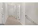 Hallway with neutral carpet and white walls and trim at 588 Whitman Ln # 23, Stockbridge, GA 30281
