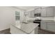 Modern kitchen features gray cabinets, granite countertops, and stainless steel appliances at 588 Whitman Ln # 23, Stockbridge, GA 30281