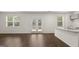 Open-concept living room with hardwood floors, lots of natural light, and access to the back deck at 588 Whitman Ln # 23, Stockbridge, GA 30281