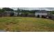 Expansive backyard featuring a well-maintained lawn and an iron fence at 883 Ironhorse Sw Ln, Mableton, GA 30126