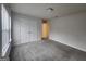A carpeted bedroom features a double door closet, a window, and neutral walls at 883 Ironhorse Sw Ln, Mableton, GA 30126