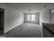 Large carpeted bedroom with lots of natural light streaming through double windows at 883 Ironhorse Sw Ln, Mableton, GA 30126