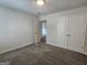 Charming bedroom with plush carpet and a neutral palette, ready for personalization at 883 Ironhorse Sw Ln, Mableton, GA 30126