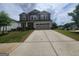 Charming two-story home with a well-manicured front lawn and a two-car garage at 883 Ironhorse Sw Ln, Mableton, GA 30126