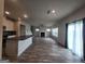 Open-concept living space connects the kitchen to the living room with fireplace at 883 Ironhorse Sw Ln, Mableton, GA 30126