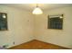 Empty bedroom with two windows, a light fixture, and neutral walls at 3296 Columbia Woods Dr, Decatur, GA 30032