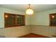 Bedroom featuring two windows, wood trim, and a ceiling light at 3296 Columbia Woods Dr, Decatur, GA 30032