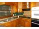 Functional kitchen with wood cabinets, stainless steel sink, and modern appliances at 3296 Columbia Woods Dr, Decatur, GA 30032