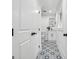 Chic bathroom showcases patterned tile floors, a sleek mirror, and a modern vanity at 4327 Welligton Hill Ln, Snellville, GA 30039