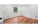 Bedroom features hardwood floors and a bright window at 4327 Welligton Hill Ln, Snellville, GA 30039
