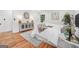 Spacious bedroom with natural light, accent cabinet with decor, and a gray area rug at 4327 Welligton Hill Ln, Snellville, GA 30039