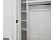 Bright white walk-in closet featuring adjustable shelving and hanging rod to organize items at 4327 Welligton Hill Ln, Snellville, GA 30039