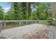 Outdoor deck overlooking lush greenery, perfect for relaxation or entertaining at 4327 Welligton Hill Ln, Snellville, GA 30039