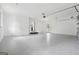 Large garage with epoxy floors, ample lighting, and access to the outside at 4327 Welligton Hill Ln, Snellville, GA 30039