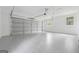 Spacious garage features an epoxy floor, two windows, and ample storage space at 4327 Welligton Hill Ln, Snellville, GA 30039