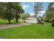 A well-maintained detached garage with an extra long driveway, providing ample parking and storage space at 4327 Welligton Hill Ln, Snellville, GA 30039