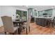 The kitchen features stainless steel appliances, stylish green cabinetry, and a central island with a marble countertop at 4327 Welligton Hill Ln, Snellville, GA 30039