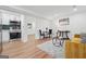 Open-concept living area with a kitchenette, dining space, and cozy seating arrangement at 4327 Welligton Hill Ln, Snellville, GA 30039