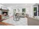 Comfortable living room showcases fireplace, hardwood flooring, neutral colors, and contemporary furnishings at 4327 Welligton Hill Ln, Snellville, GA 30039