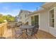 Back porch view with outdoor table and backyard at 4811 Nevilly Way, Marietta, GA 30066